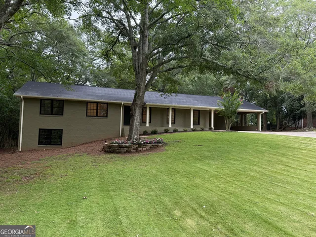 a backyard of a house with seating space