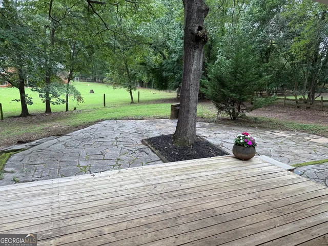 a house with trees in the background