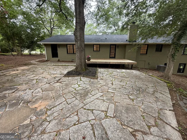 a view of a yard with large trees