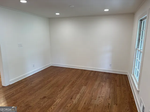 a view of a kitchen with a sink and a refrigerator
