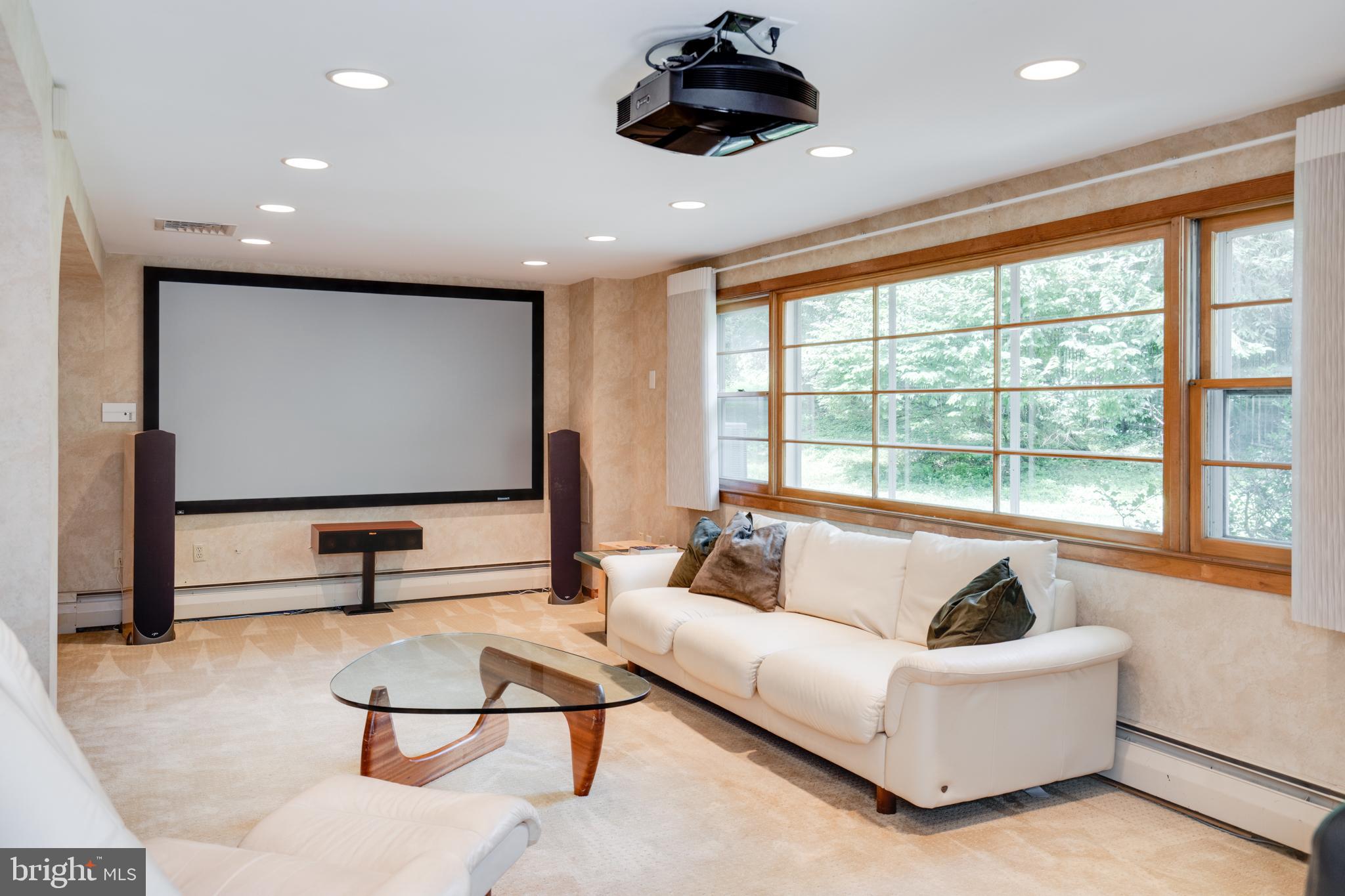 1501 Mt Pleasant Road Villanova, PA 19085 - Photo 25 of 49 a living room with furniture gym equipment and a large window
