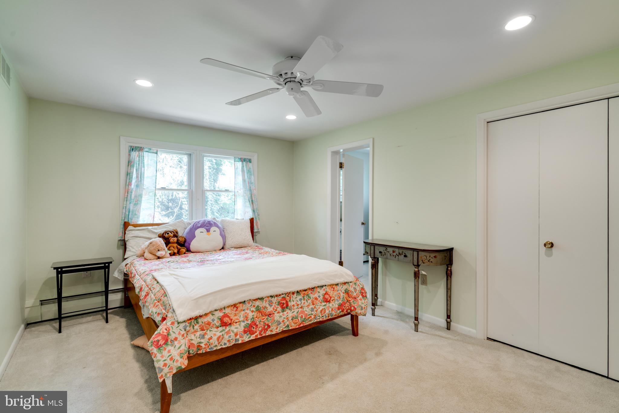 1501 Mt Pleasant Road Villanova, PA 19085 - Photo 30 of 49 a bedroom with a bed and a chandelier