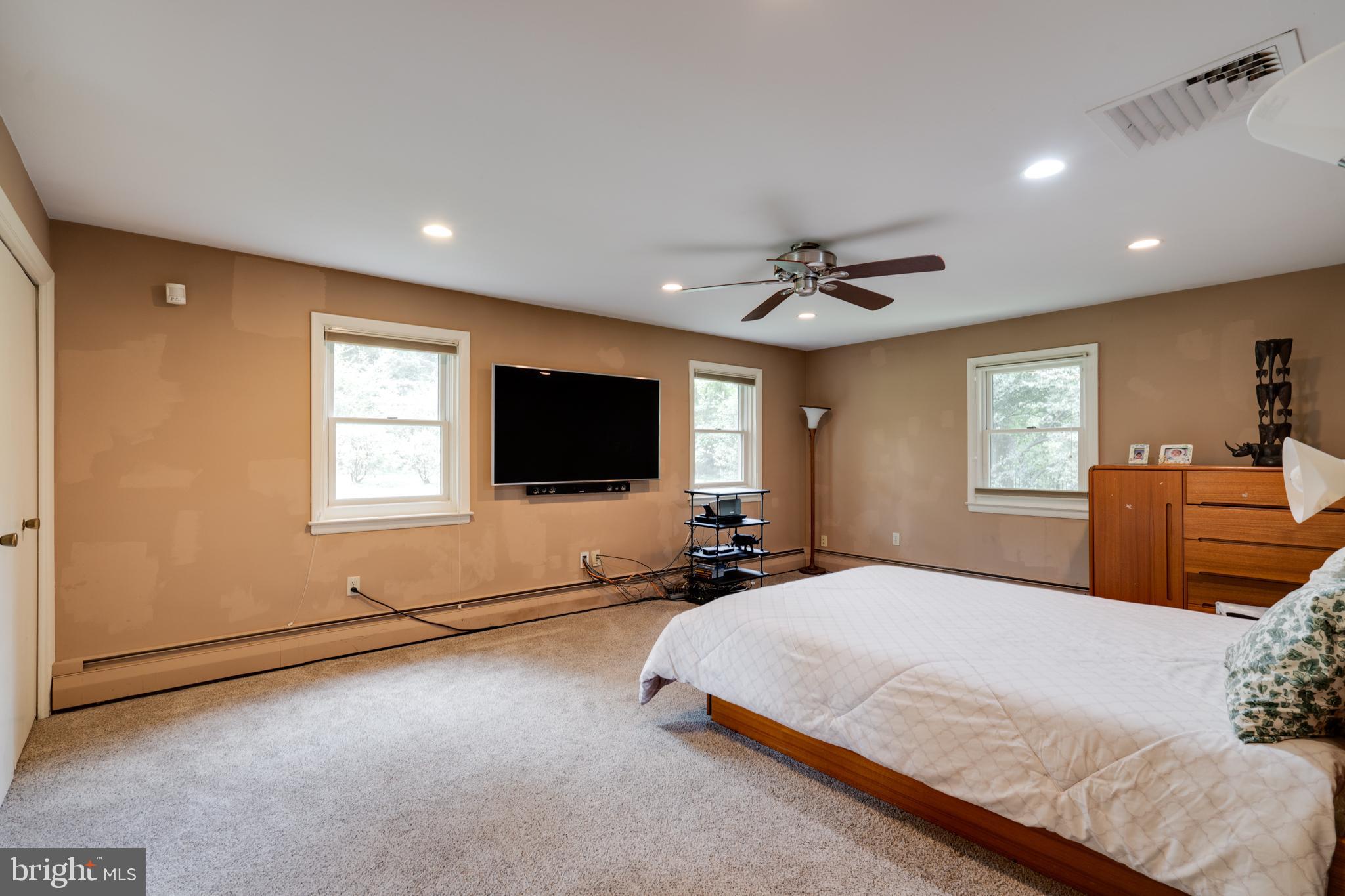 1501 Mt Pleasant Road Villanova, PA 19085 - Photo 32 of 49 a bedroom with a bed and a flat screen tv