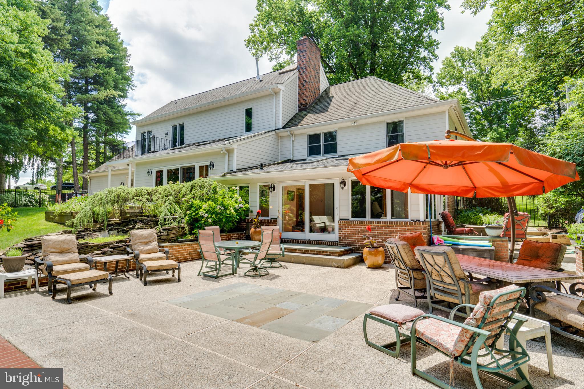 1501 Mt Pleasant Road Villanova, PA 19085 - Photo 46 of 49 a view of a patio with a table and chairs under an umbrella
