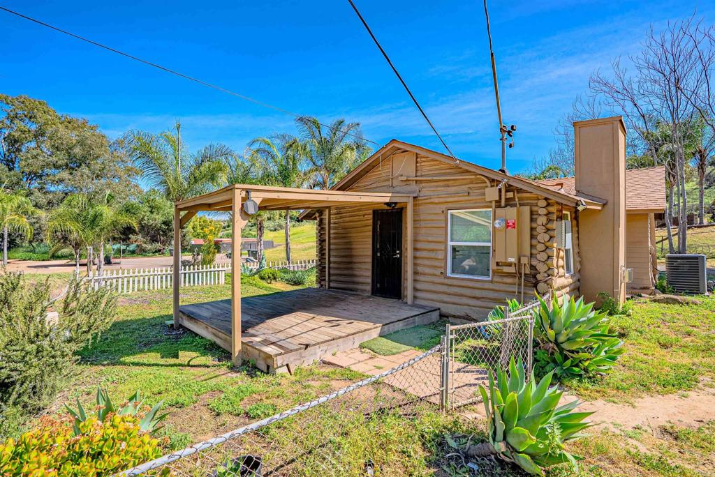 11977 Demi Lee Lane Lakeside, CA 92040 - Photo 14 of 22 a front view of a house with a garden