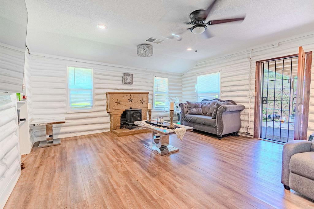 11977 Demi Lee Lane Lakeside, CA 92040 - Photo 15 of 22 a living room with furniture floor to ceiling window and wooden floor