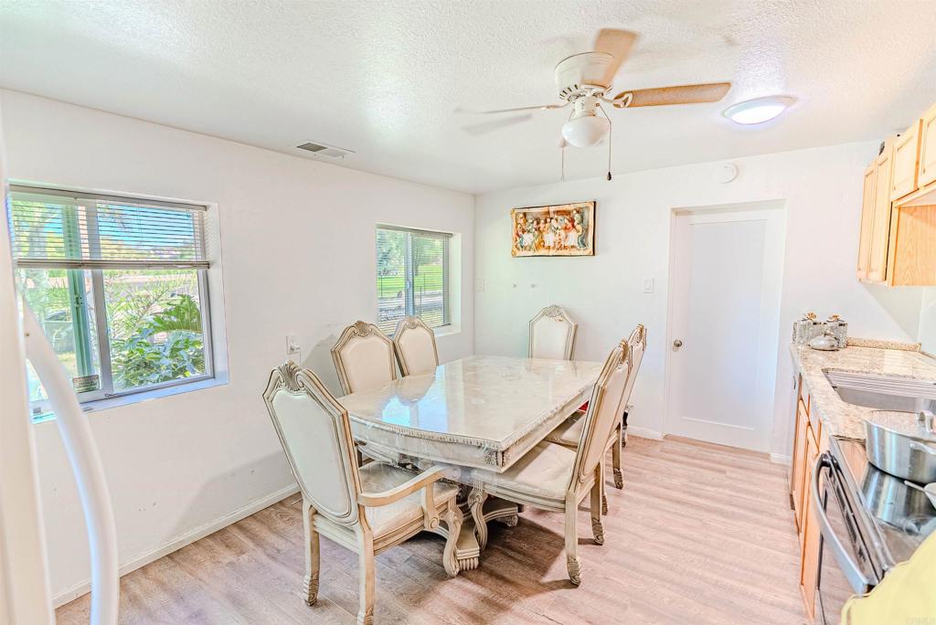 11977 Demi Lee Lane Lakeside, CA 92040 - Photo 16 of 22 a view of a dining room with furniture window and wooden floor