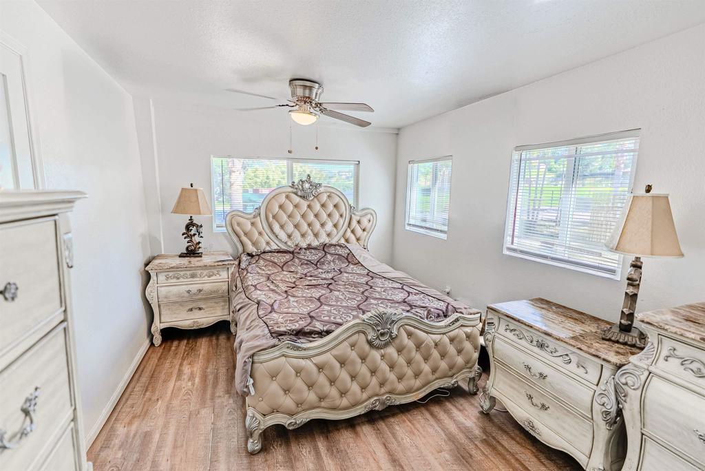 11977 Demi Lee Lane Lakeside, CA 92040 - Photo 18 of 22 a bedroom with a bed and wooden floor