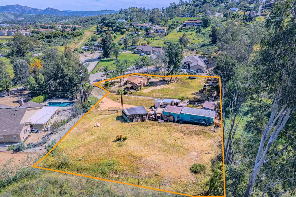 11977 Demi Lee Lane Lakeside, CA 92040 - Photo 6 of 22 an aerial view of a swimming pool with a yard and mountain view