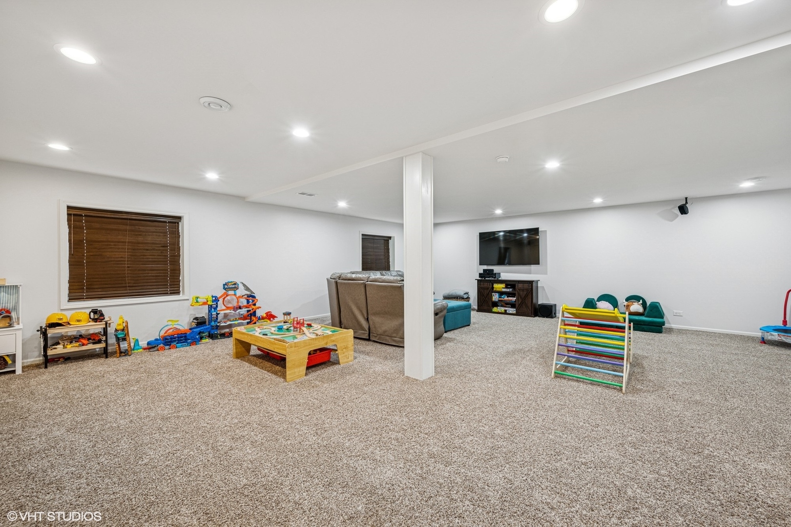 350 Sterling Circle Cary, IL 60013 - Photo 22 of 31 a living room with furniture and a flat screen tv