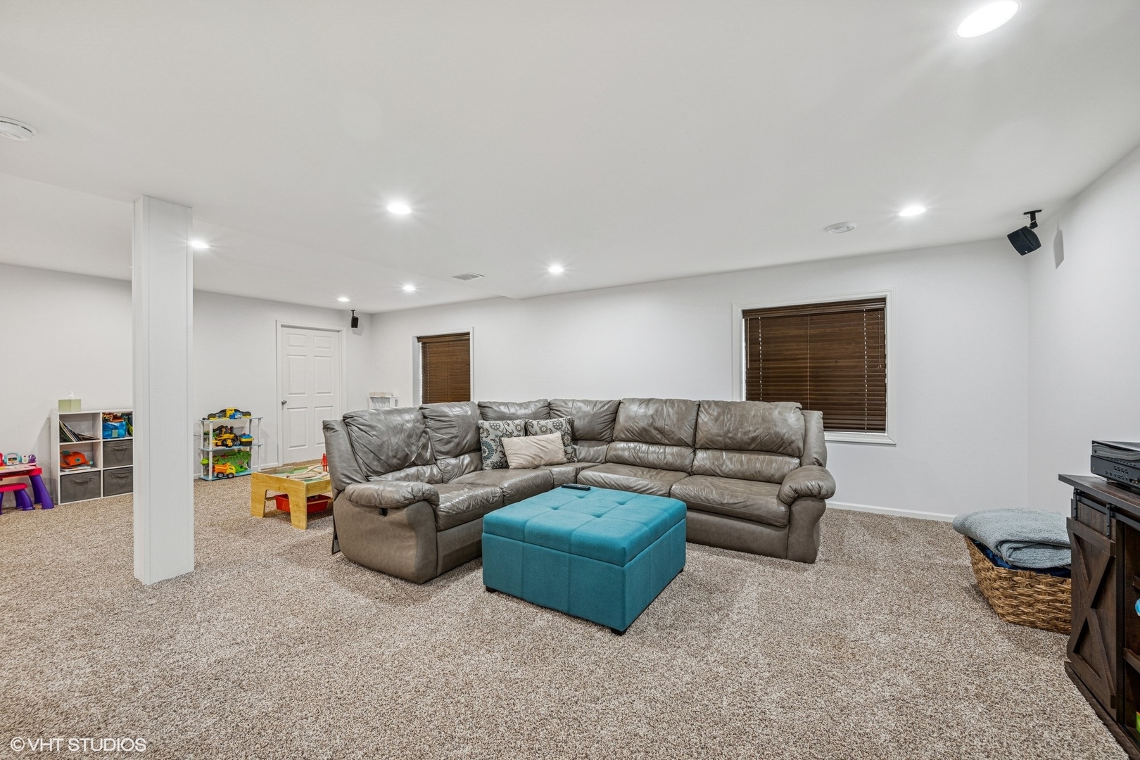 350 Sterling Circle Cary, IL 60013 - Photo 23 of 31 a living room with furniture a flat screen tv and a window