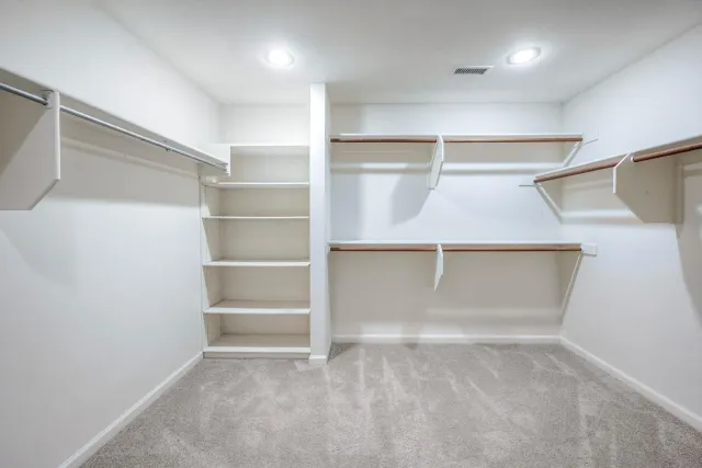 a view of an empty walk in closet