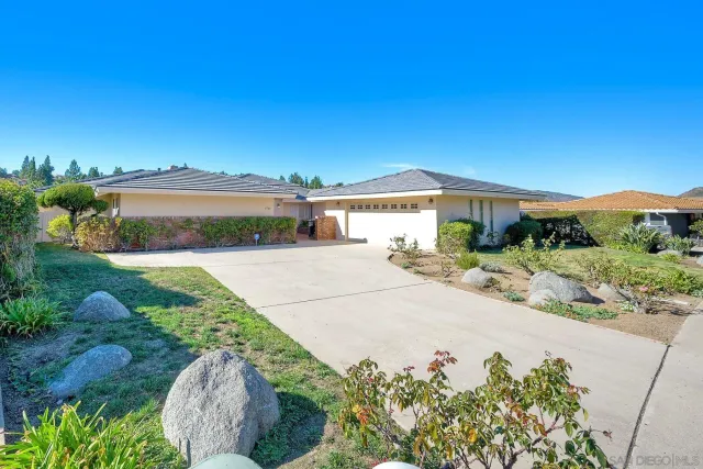 a view of a garden with a building in the background