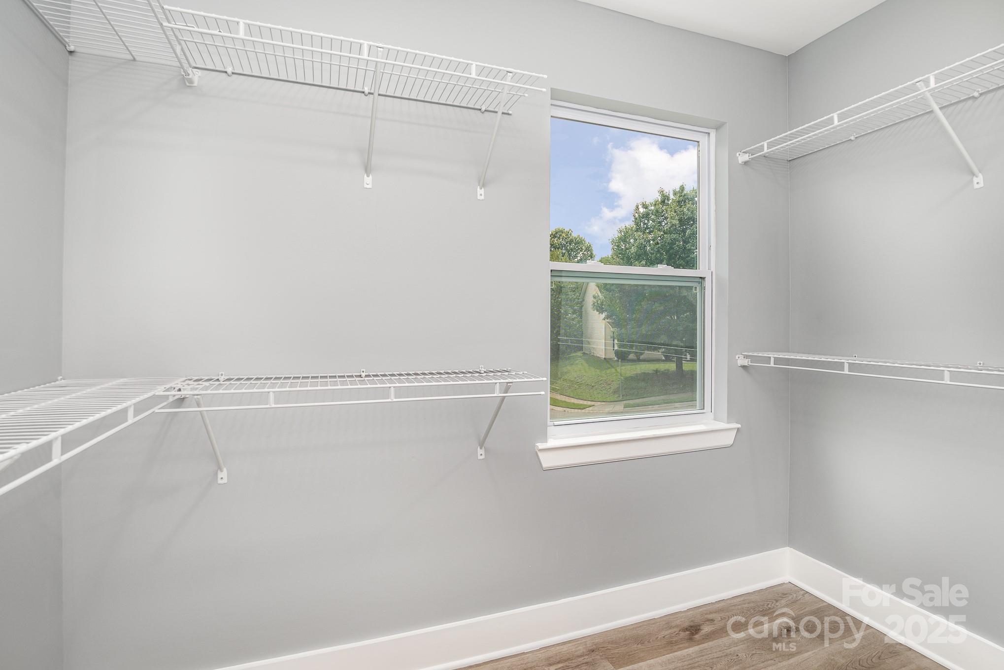 938 Valley Ridge Road Charlotte, NC 28214 - Photo 14 of 22 a view of a small space with wooden floor and a window