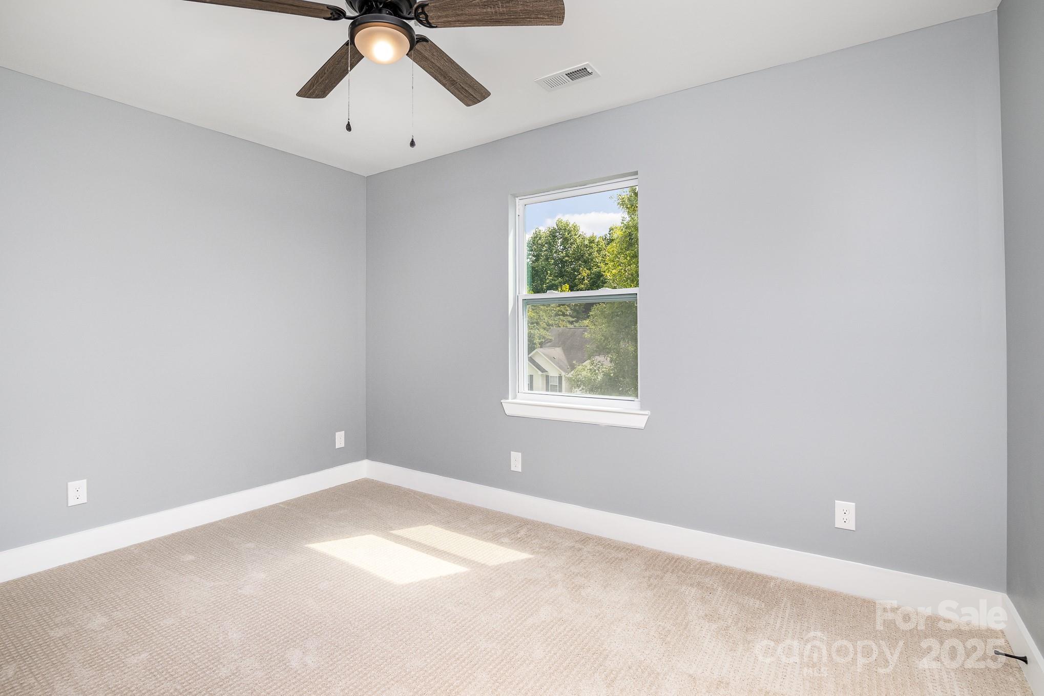 938 Valley Ridge Road Charlotte, NC 28214 - Photo 16 of 22 an empty room with a window