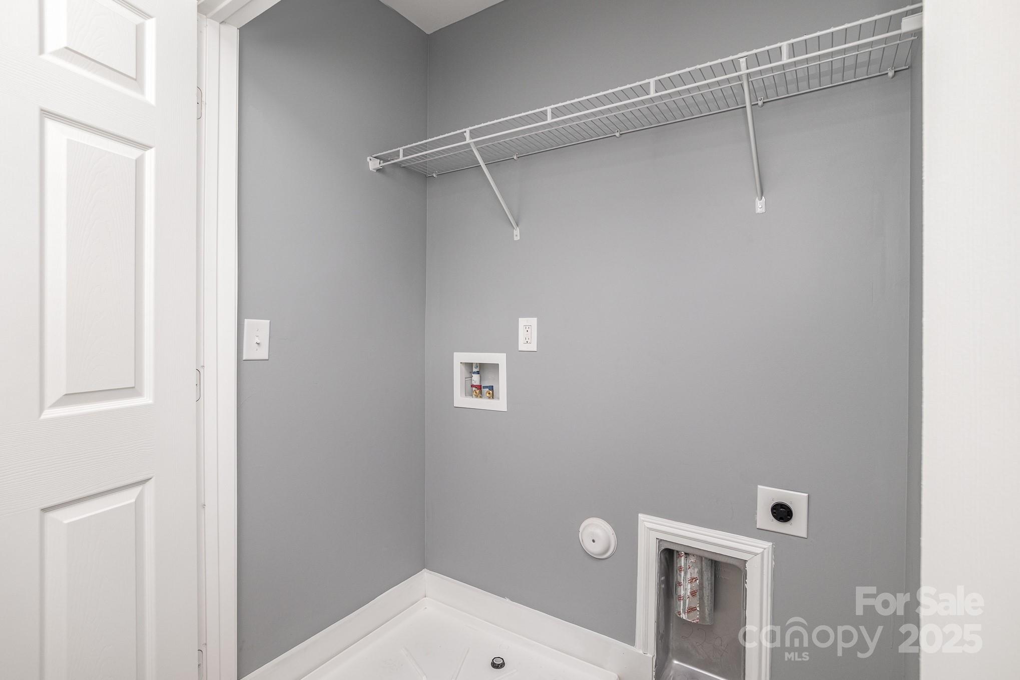 938 Valley Ridge Road Charlotte, NC 28214 - Photo 19 of 22 a bathroom with a shower toilet and sink