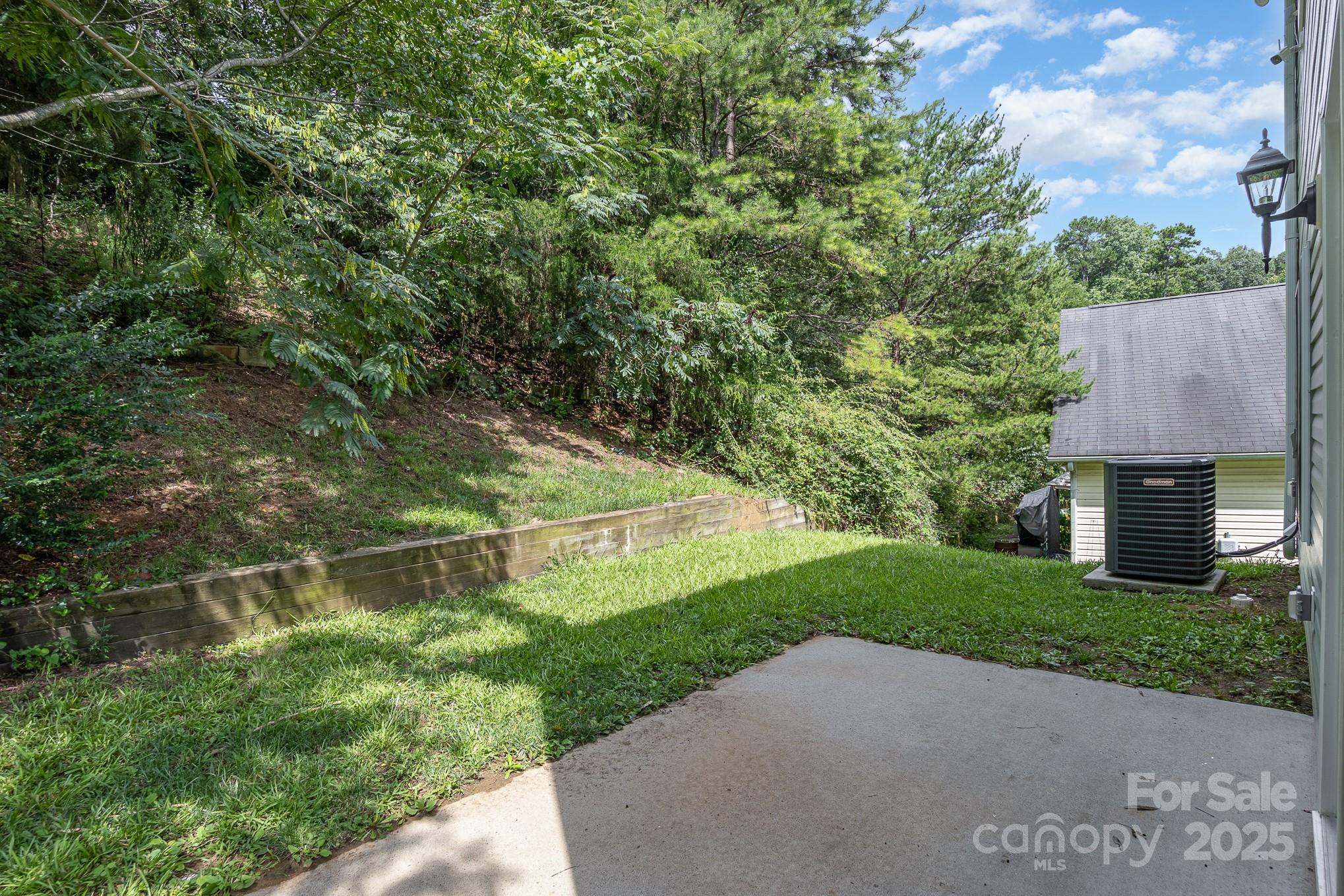 938 Valley Ridge Road Charlotte, NC 28214 - Photo 21 of 22 a view of a backyard with a small house