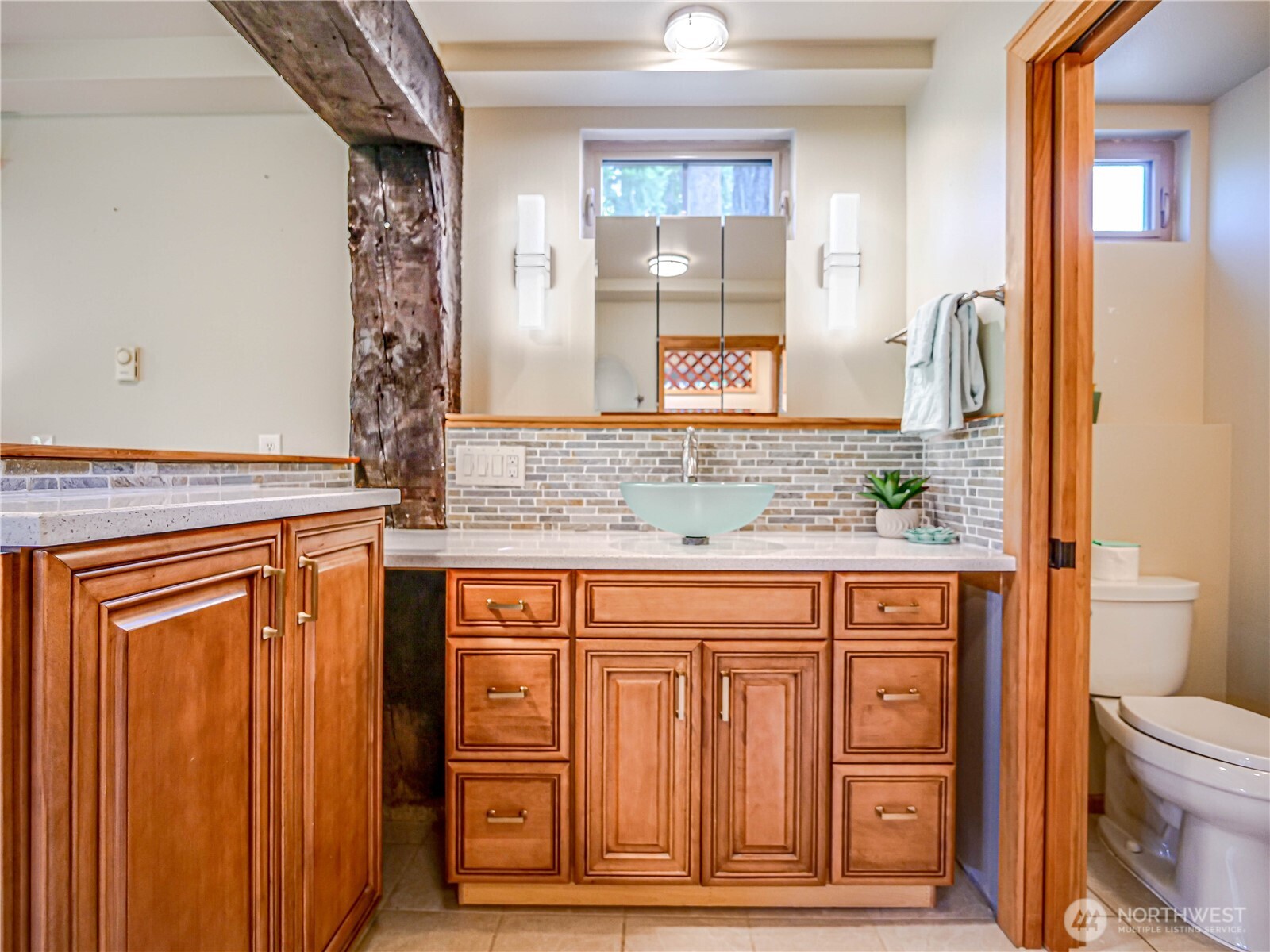18612 51st Avenue Southeast Bothell, WA 98012 - Photo 13 of 20 a bathroom with a granite countertop sink and a mirror