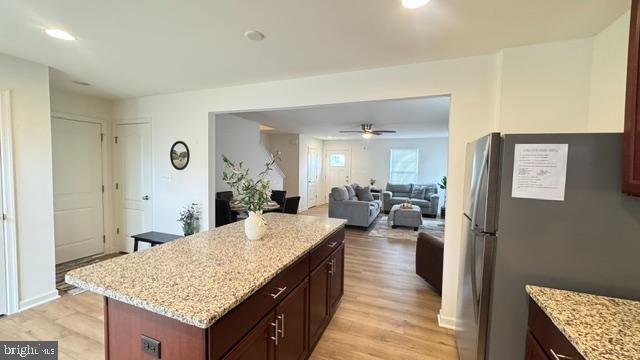 65 Chesterfield Road East Berlin, PA 17316 - Photo 8 of 32 a large living room with granite countertop kitchen island furniture and a wooden floor