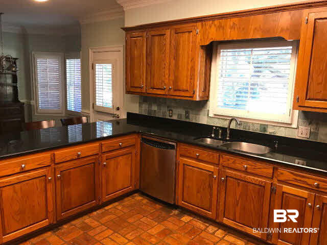 401 Potters Mills Road Daphne, AL 36526 - Photo 9 of 28 For Sale: 401 Potters Mill Avenue, Daphne, AL 36526 Large kitchen with barstool area