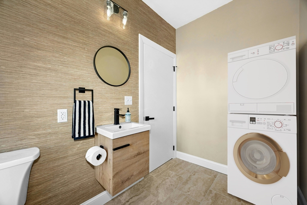 15 Arthur Street, Unit 15 Maynard, MA 01754 - Photo 11 of 21 a bathroom with a sink mirror and vanity