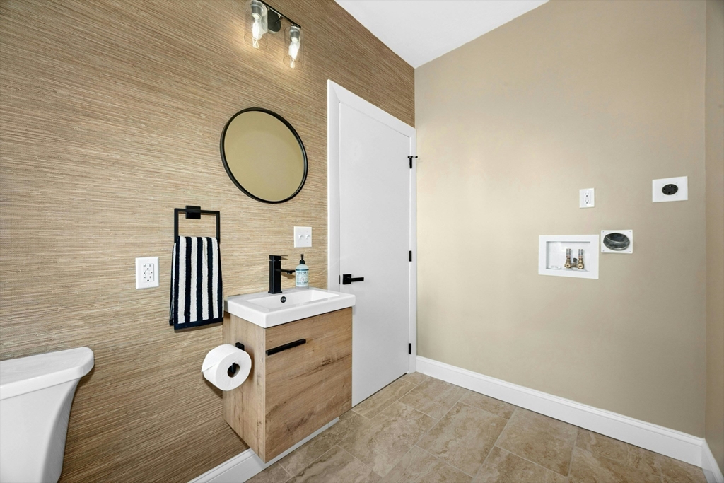 15 Arthur Street, Unit 15 Maynard, MA 01754 - Photo 12 of 21 a bathroom with a sink mirror and vanity