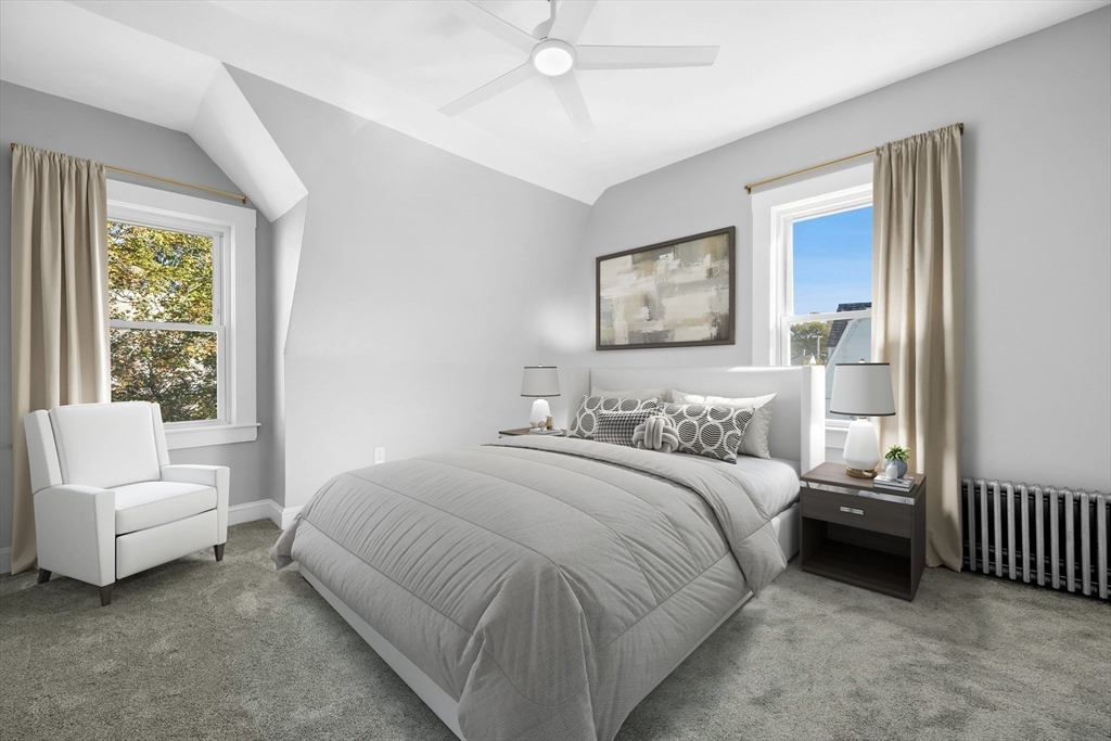 15 Arthur Street, Unit 15 Maynard, MA 01754 - Photo 13 of 21 a bedroom with a bed and a couch