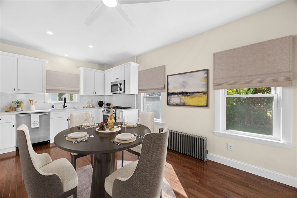 15 Arthur Street, Unit 15 Maynard, MA 01754 - Photo 5 of 21 a view of a dining room with furniture and wooden floor