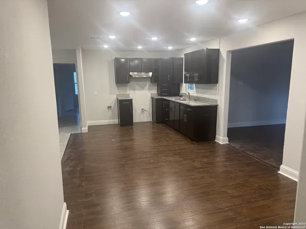 a view of kitchen with wooden floor