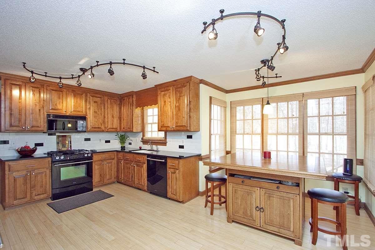 6124 Wolverhampton Drive Raleigh, NC 27603 - Photo 3 of 25 Granite countertops and Jenn Air appliances