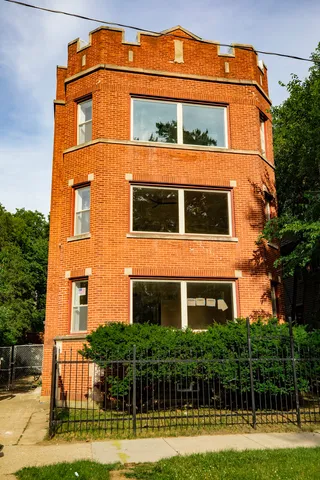a front view of a building with garden