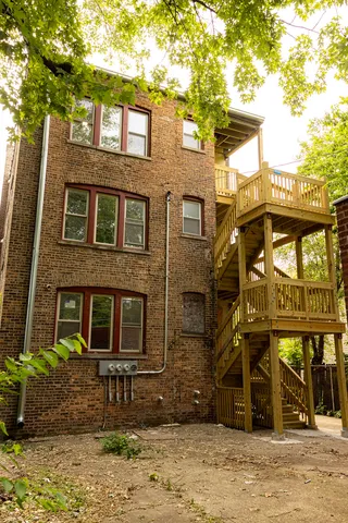 a front view of a brick building with many windows