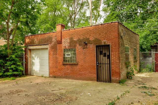 a view of a house with a yard and garage