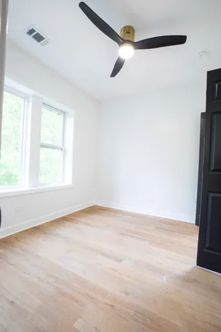 a view of an empty room with a window