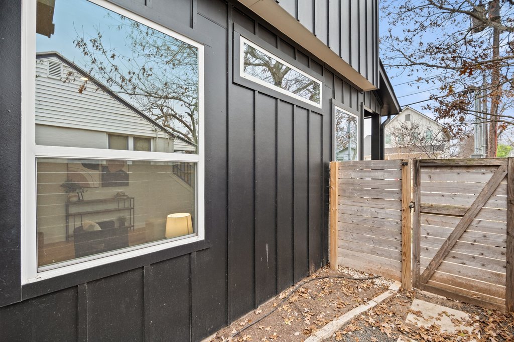 928 East 53rd 1/2 Street, Unit 1 Austin, TX 78751 - Photo 35 of 40 Doorway to property featuring board and batten siding and a gate