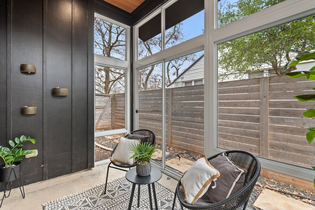 928 East 53rd 1/2 Street, Unit 1 Austin, TX 78751 - Photo 6 of 40 Sunroom featuring a patio and healthy amount of natural light