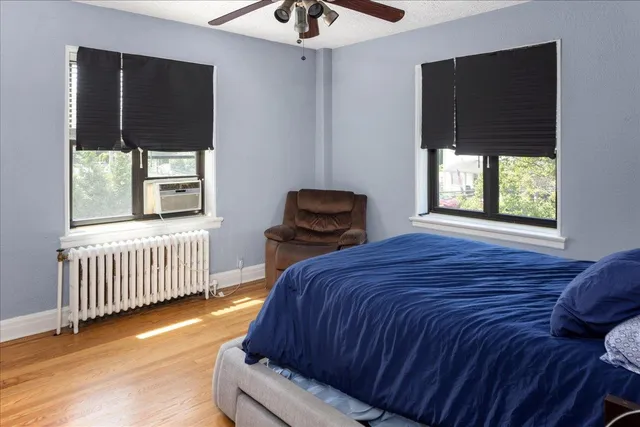 a bedroom with a bed and window