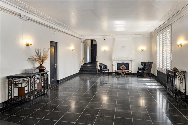 a view of walk in closet with a mirror