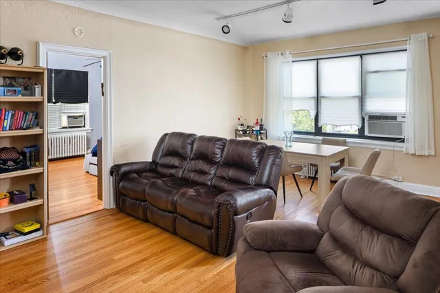 a dining room with furniture and window
