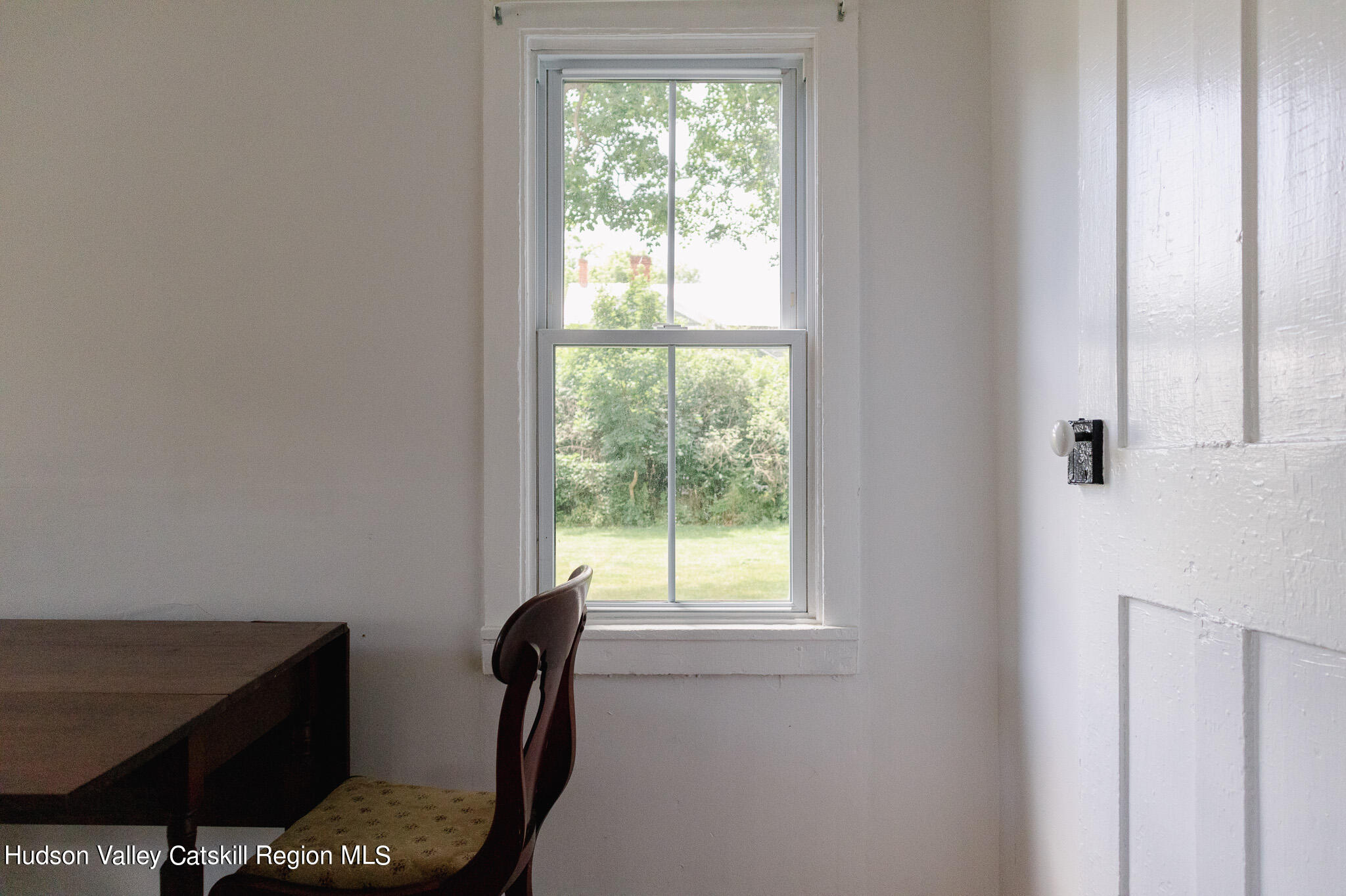 35 County Rte 351 Medusa, NY 12120 - Photo 11 of 32 a view of a livingroom with furniture and a window