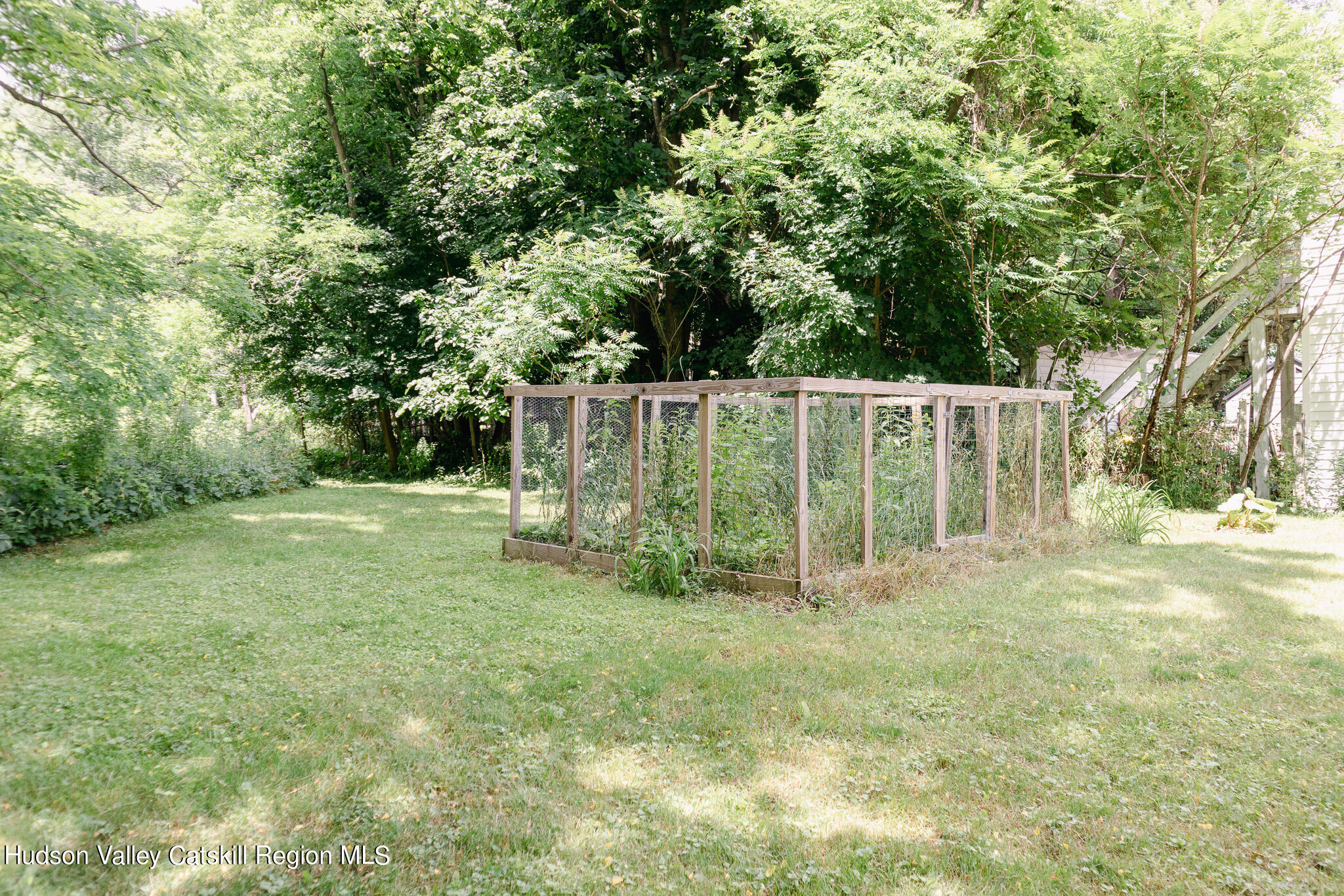 35 County Rte 351 Medusa, NY 12120 - Photo 30 of 32 a view of a garden with wooden fence
