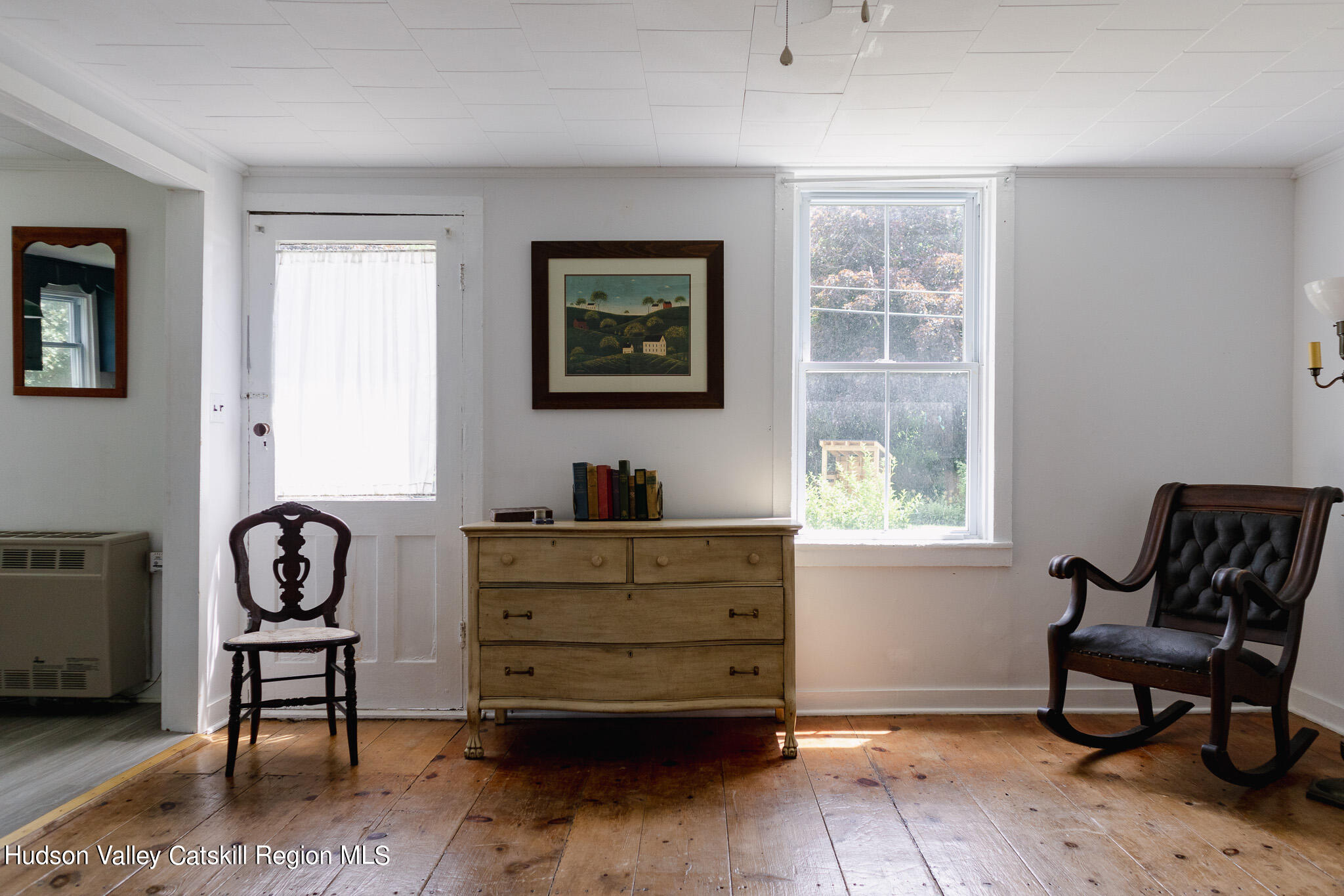 35 County Rte 351 Medusa, NY 12120 - Photo 10 of 32 a bedroom with a window and a chair