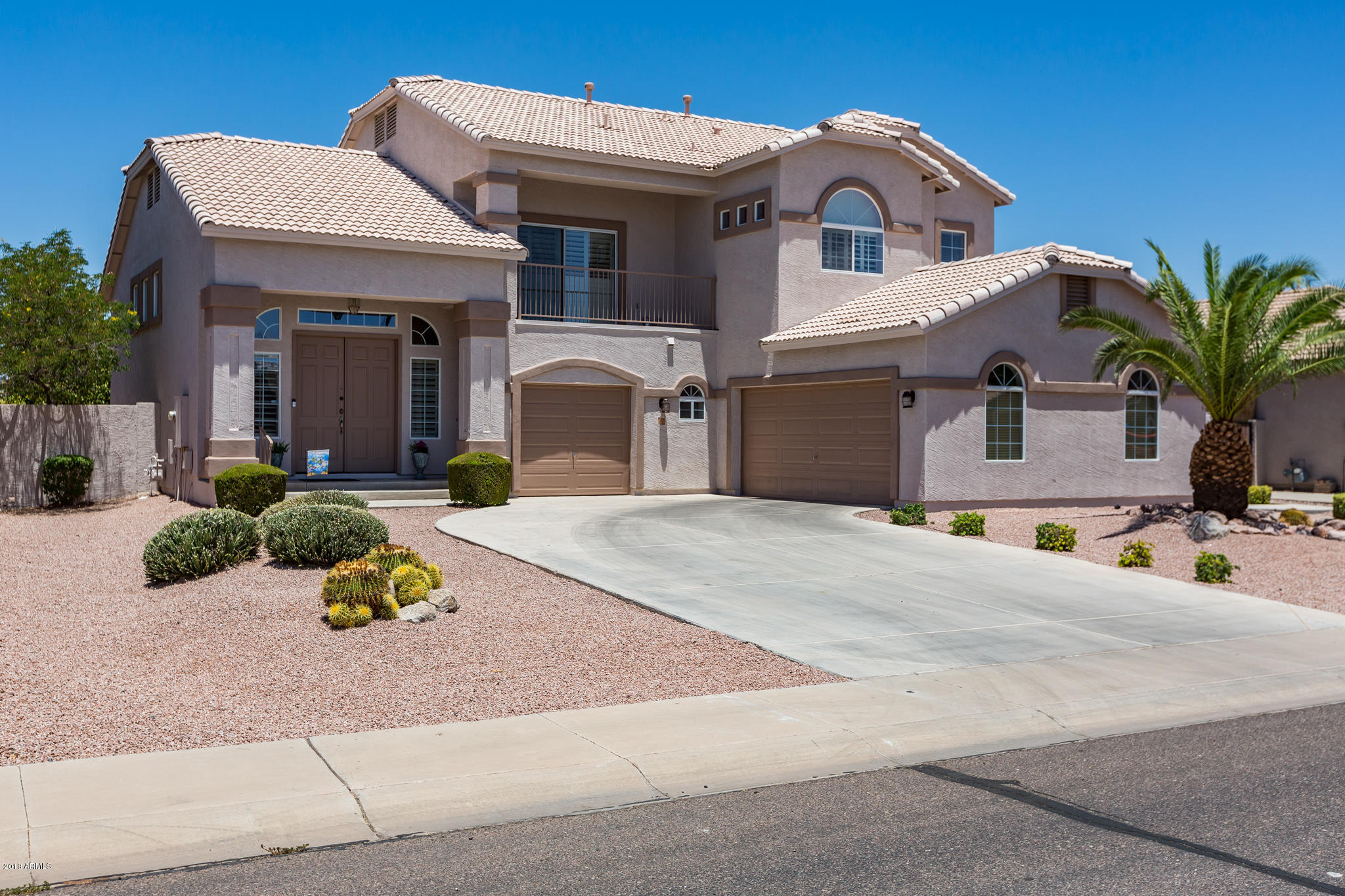 3744 East Del Rio Street Gilbert, AZ 85295 - Photo 2 of 32 a front view of a house with garden