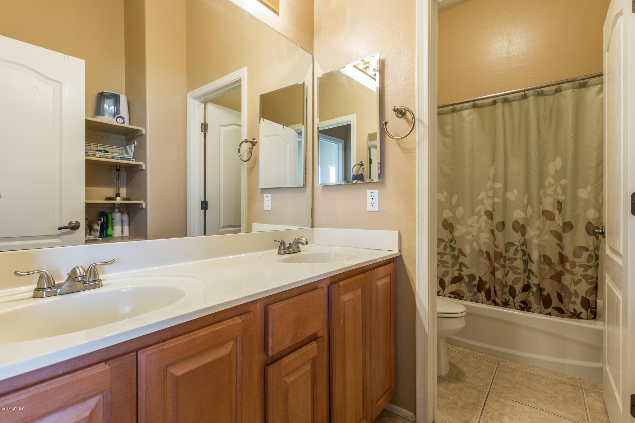 3744 East Del Rio Street Gilbert, AZ 85295 - Photo 21 of 32 a bathroom with a granite countertop sink and a mirror