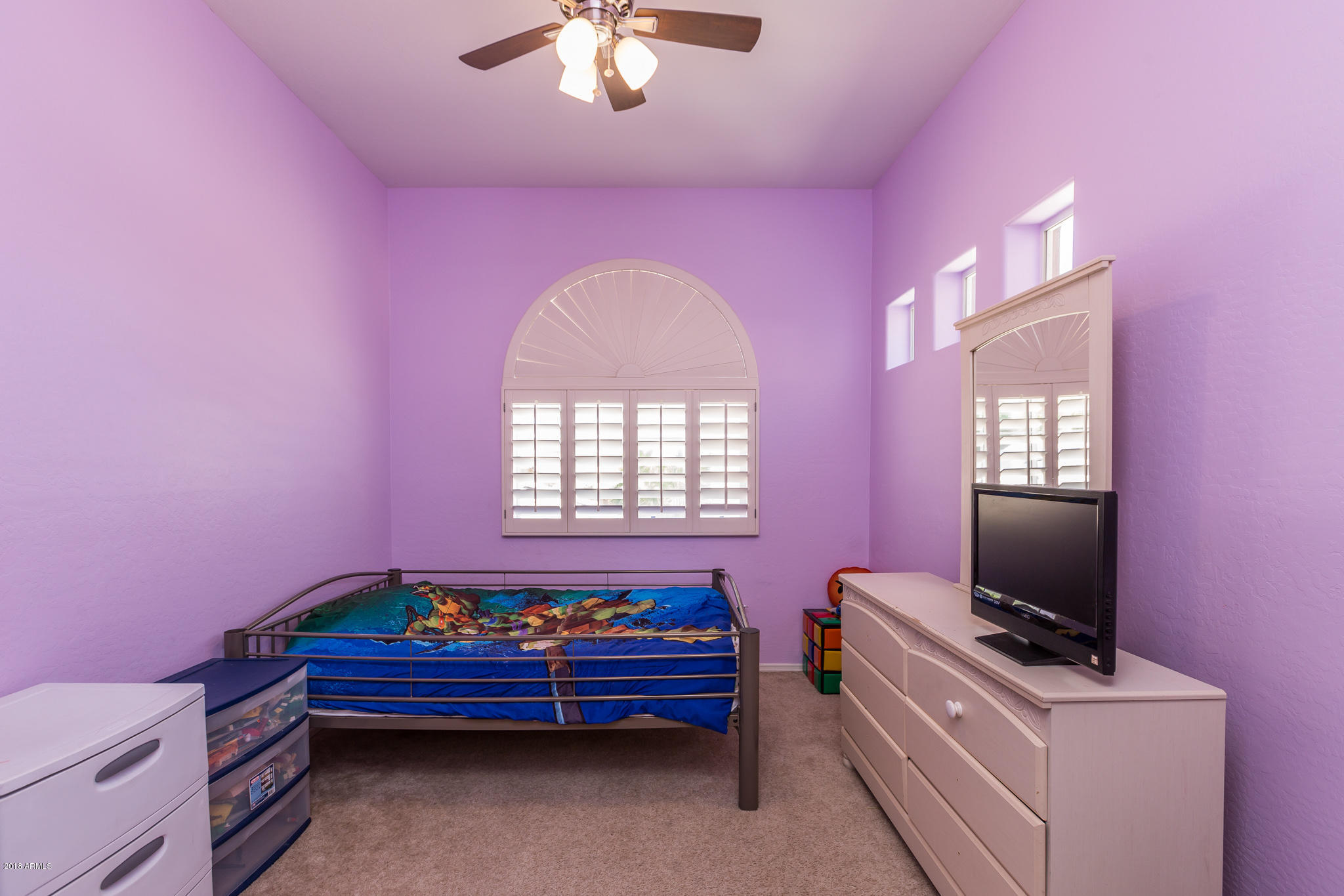 3744 East Del Rio Street Gilbert, AZ 85295 - Photo 23 of 32 a bedroom with furniture and a flat screen tv