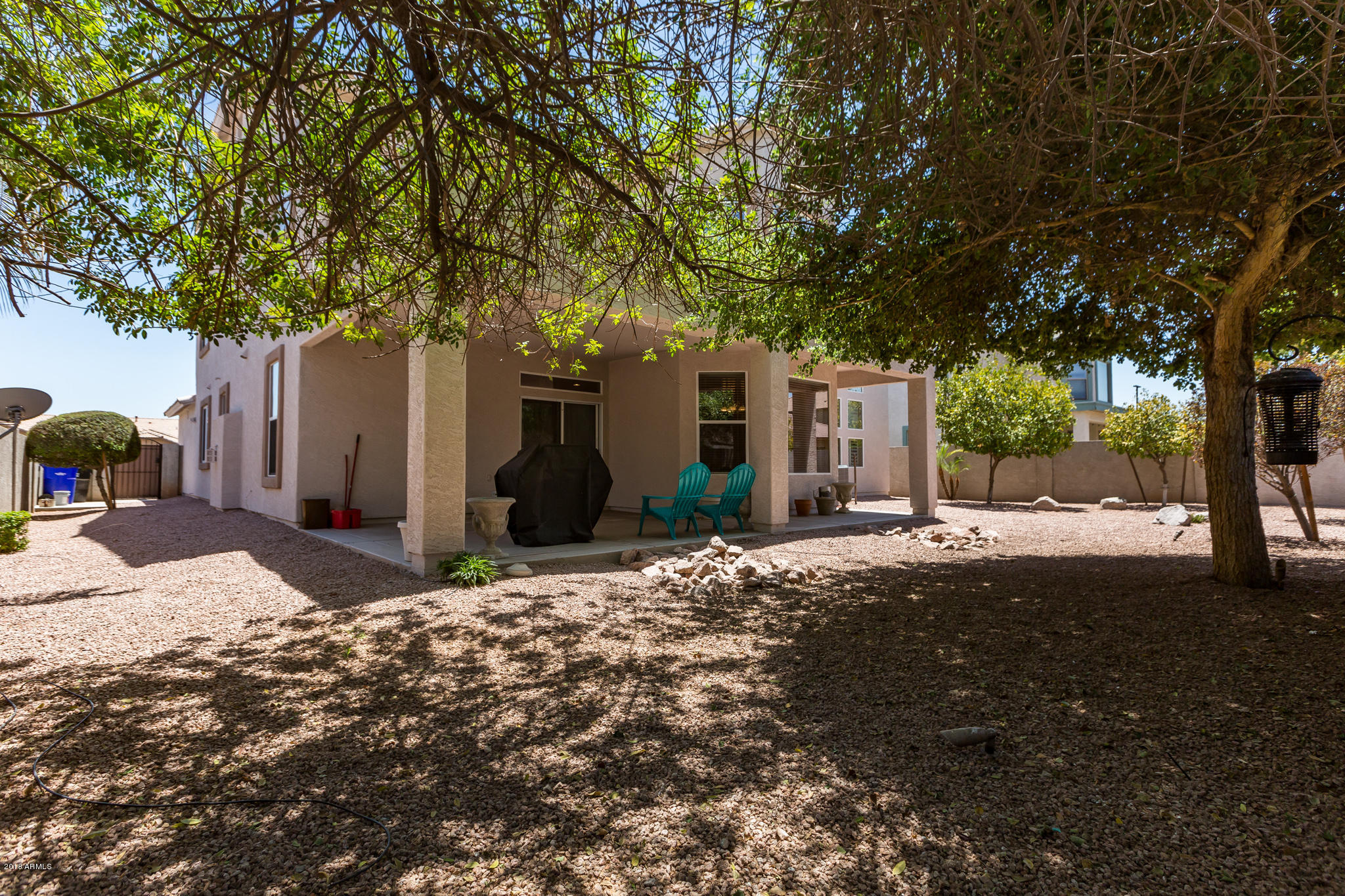 3744 East Del Rio Street Gilbert, AZ 85295 - Photo 24 of 32 a front view of a house with a yard and garage