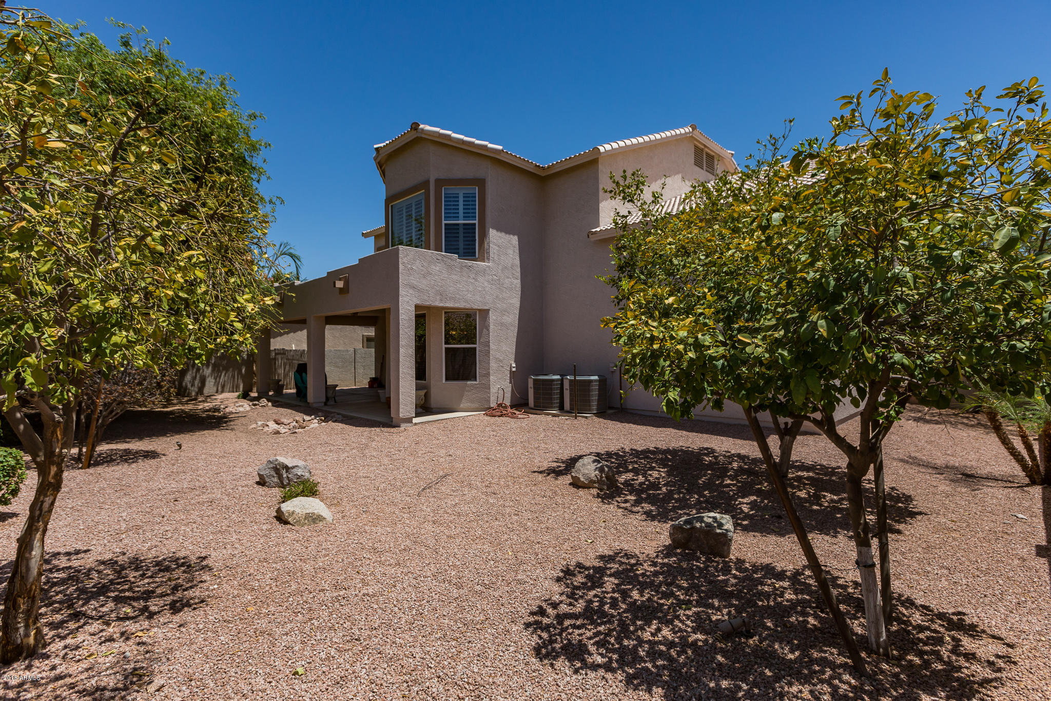 3744 East Del Rio Street Gilbert, AZ 85295 - Photo 25 of 32 a front view of a house with a yard