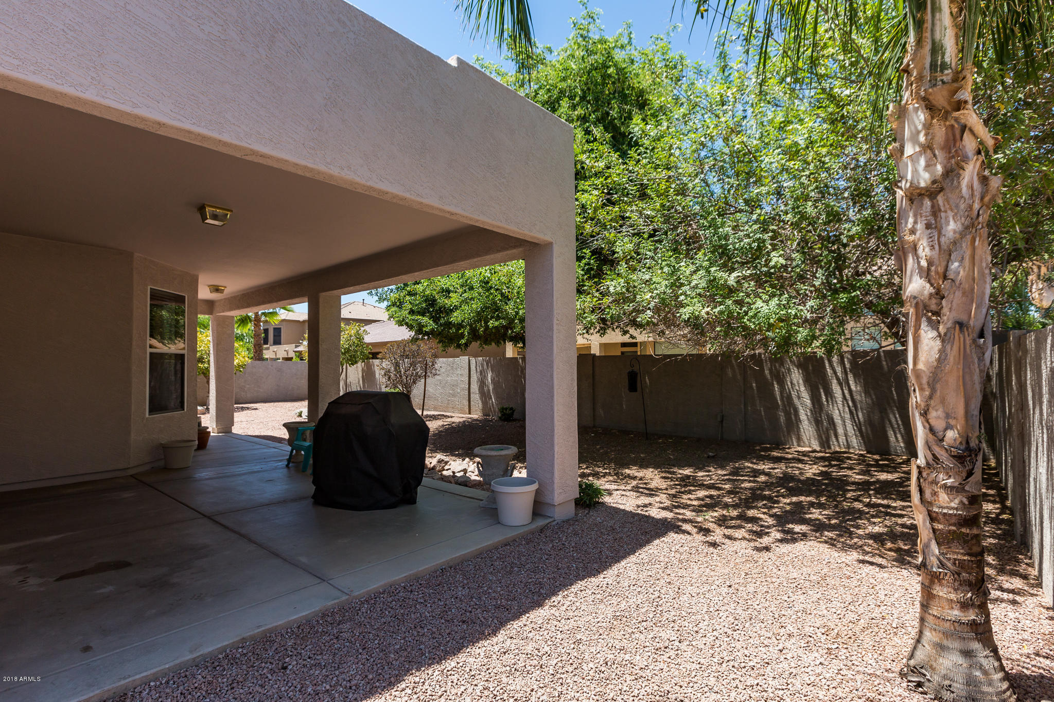 3744 East Del Rio Street Gilbert, AZ 85295 - Photo 26 of 32 a view of a chairs and table in backyard