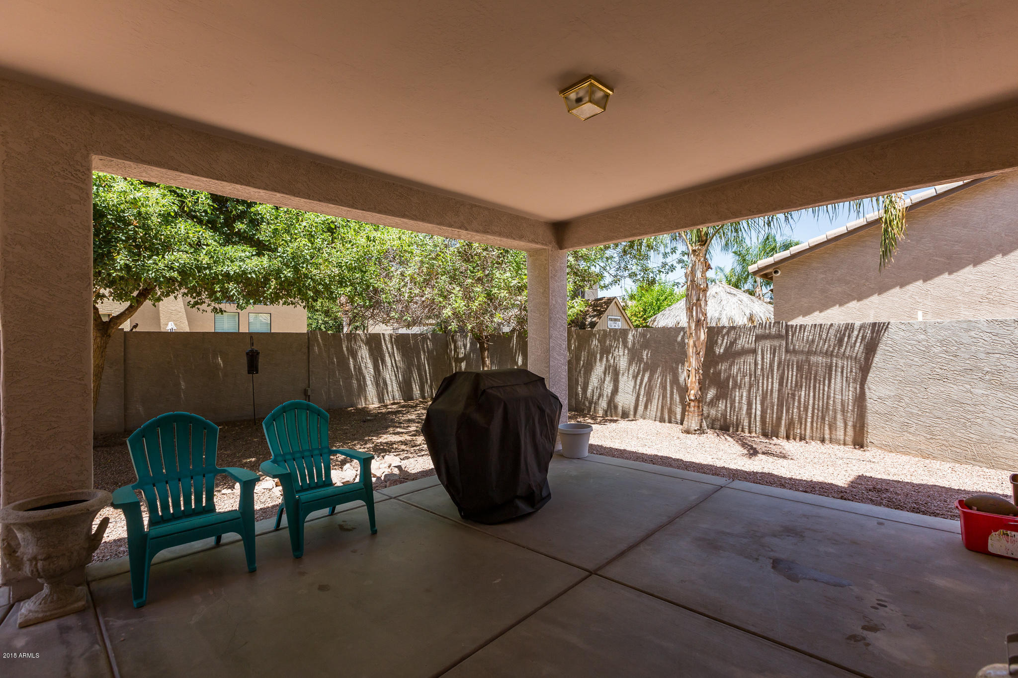3744 East Del Rio Street Gilbert, AZ 85295 - Photo 27 of 32 a view of a chairs and table in the patio