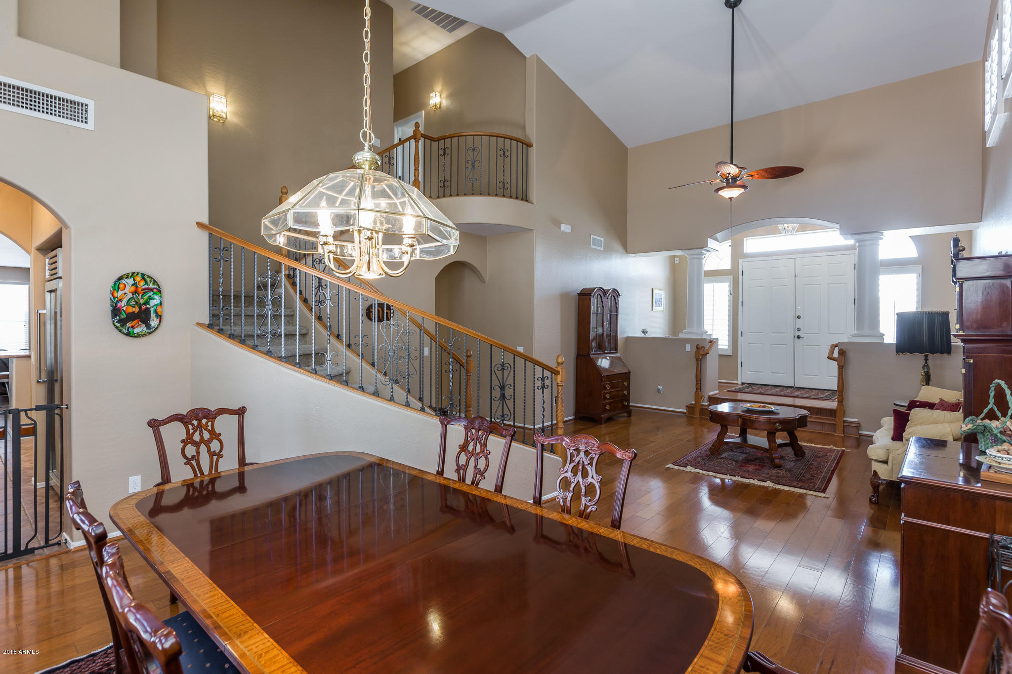 3744 East Del Rio Street Gilbert, AZ 85295 - Photo 5 of 32 a dining room with furniture a chandelier and wooden floor